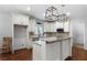 Well-lit kitchen featuring granite countertops, stainless steel appliances, custom cabinets and kitchen island at 42 Treemont Se Dr, Cartersville, GA 30121