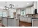 Well-lit kitchen with stainless steel appliances and granite counters opens to dining area at 42 Treemont Se Dr, Cartersville, GA 30121