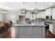 Bright kitchen showcasing granite counters, stainless steel appliances, an island, and an adjacent dining area at 42 Treemont Se Dr, Cartersville, GA 30121