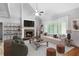 Inviting living room with fireplace, high ceilings, and plenty of natural light, adjacent to the kitchen at 42 Treemont Se Dr, Cartersville, GA 30121