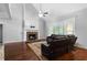 Cozy living room features stone fireplace, hardwood floors, and natural light at 42 Treemont Se Dr, Cartersville, GA 30121