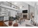 Bright living room with fireplace and loft, seamlessly connected to a gourmet kitchen and bar area at 42 Treemont Se Dr, Cartersville, GA 30121