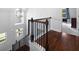 Staircase with dark wood and wrought iron railing at 42 Treemont Se Dr, Cartersville, GA 30121