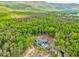 Beautiful home surrounded by vibrant green trees, offering privacy and scenic views at 555 E Valley Ne Rd, Rydal, GA 30171