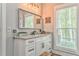 Bright bathroom with granite countertop, undermount sink and stylish vanity lighting at 555 E Valley Ne Rd, Rydal, GA 30171