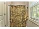 Bathroom featuring a shower with a camo curtain and natural light at 555 E Valley Ne Rd, Rydal, GA 30171