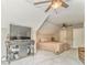 Bedroom features a large television, ceiling fans, and carpeted floors at 555 E Valley Ne Rd, Rydal, GA 30171