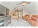 Spacious bonus room with carpet, ceiling fan, tv, and comfortable seating at 555 E Valley Ne Rd, Rydal, GA 30171