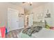 Comfortable bedroom with wood floors, neutral walls, and ample closet space, creating a cozy and inviting atmosphere at 555 E Valley Ne Rd, Rydal, GA 30171