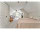 Bedroom features a bed, sofa, large window, and carpeted floors at 555 E Valley Ne Rd, Rydal, GA 30171
