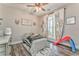 Stylish bedroom with unique decor, ceiling fan and hardwood floors at 555 E Valley Ne Rd, Rydal, GA 30171