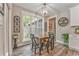 Charming dining area featuring rustic decor and a view of the lush surroundings at 555 E Valley Ne Rd, Rydal, GA 30171