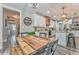 Open concept eat-in kitchen area with counter seating and stainless steel appliances at 555 E Valley Ne Rd, Rydal, GA 30171