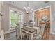 Cozy dining area with a chandelier and a view of the outdoor scenery at 555 E Valley Ne Rd, Rydal, GA 30171