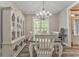 Elegant dining room featuring a chandelier, wood floors, and a large window with a view at 555 E Valley Ne Rd, Rydal, GA 30171
