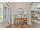 Foyer with hardwood floors, decorative table, and views to the living room at 555 E Valley Ne Rd, Rydal, GA 30171