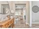 Foyer with decorative wooden table with decor and view to living room and dining room at 555 E Valley Ne Rd, Rydal, GA 30171