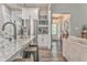 Kitchen with stainless steel appliances, granite countertops, and an open view to the foyer at 555 E Valley Ne Rd, Rydal, GA 30171