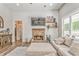 Inviting living room featuring a fireplace, comfortable seating, and stylish decor, creating a cozy and welcoming space at 555 E Valley Ne Rd, Rydal, GA 30171