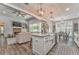 Open concept living room with fireplace and TV. Kitchen features large island with sink at 555 E Valley Ne Rd, Rydal, GA 30171