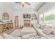 Well-lit living room featuring a fireplace, natural light, and a spacious layout, perfect for relaxation and entertainment at 555 E Valley Ne Rd, Rydal, GA 30171