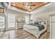 Serene bedroom with wood ceiling, offering a cozy retreat with elegant decor and natural light at 555 E Valley Ne Rd, Rydal, GA 30171
