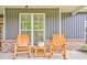 Charming front porch with rocking chairs overlooking the green front yard at 555 E Valley Ne Rd, Rydal, GA 30171