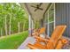 Inviting covered porch with rocking chairs and a view of the lush green landscape at 555 E Valley Ne Rd, Rydal, GA 30171