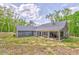 Home with large covered patio with outdoor dining and grill, perfect for entertaining guests at 555 E Valley Ne Rd, Rydal, GA 30171