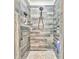 Shower features wood look tile, mosaic flooring, rainfall shower head, and built in storage at 555 E Valley Ne Rd, Rydal, GA 30171