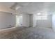 Large basement room with carpet flooring, drop ceiling, and multiple access doors and closet, great for customization at 5723 Fieldstone Dr, Lithonia, GA 30038