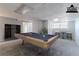 This staged basement features a billiard table, bar stools, and space for entertainment at 5723 Fieldstone Dr, Lithonia, GA 30038