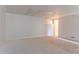 A carpeted basement room with neutral walls and ceiling, offering a blank canvas for customization at 5723 Fieldstone Dr, Lithonia, GA 30038