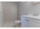 This partial bathroom has a white tiled floor, white toilet, and vanity with silver fixtures at 5723 Fieldstone Dr, Lithonia, GA 30038