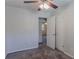 Bedroom with neutral walls and carpet, featuring a ceiling fan and closet at 5723 Fieldstone Dr, Lithonia, GA 30038