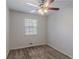 Empty bedroom featuring neutral walls and carpet, ceiling fan, and window at 5723 Fieldstone Dr, Lithonia, GA 30038