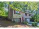 Charming two-story home with red shutters, stone accents, and a welcoming entrance at 5723 Fieldstone Dr, Lithonia, GA 30038