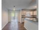 Bright kitchen with white cabinets, granite countertops, stainless steel sink, and patio access at 5723 Fieldstone Dr, Lithonia, GA 30038