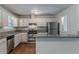 Bright kitchen with granite counters, stainless steel appliances, and white cabinetry at 5723 Fieldstone Dr, Lithonia, GA 30038