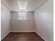 This small room includes vinyl floors, a window, and neutral colored walls ready for customization at 5723 Fieldstone Dr, Lithonia, GA 30038