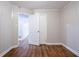 Bedroom showcasing hardwood floors, paneled walls, and white trim at 941 Reed Ave, Atlanta, GA 30344