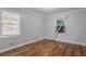 Bedroom featuring neutral walls, wood floors, and two windows at 941 Reed Ave, Atlanta, GA 30344