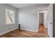 Bedroom featuring neutral walls, wood floors, and entry to hallway at 941 Reed Ave, Atlanta, GA 30344