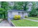 Cozy home with manicured lawn, welcoming porch, and convenient driveway at 941 Reed Ave, Atlanta, GA 30344