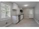 Well-lit kitchen with stainless steel appliances and convenient access to the back door at 941 Reed Ave, Atlanta, GA 30344