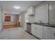 Stylish kitchen adjacent to the living area features stainless steel appliances and tiled flooring at 941 Reed Ave, Atlanta, GA 30344