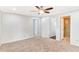 Neutral bedroom featuring a ceiling fan, carpeted floors and white doors and trim at 1398 Woodland Ave, Atlanta, GA 30316