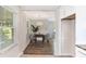 Elegant dining room with modern chandelier and views of a large window at 1398 Woodland Ave, Atlanta, GA 30316