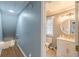 Bathroom features a sink, vanity, toilet and is accessed by a small staircase at 141 S Fairfield Dr, Peachtree City, GA 30269