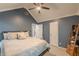 Bedroom with vaulted ceiling, ceiling fan, ensuite bathroom, and closet at 141 S Fairfield Dr, Peachtree City, GA 30269